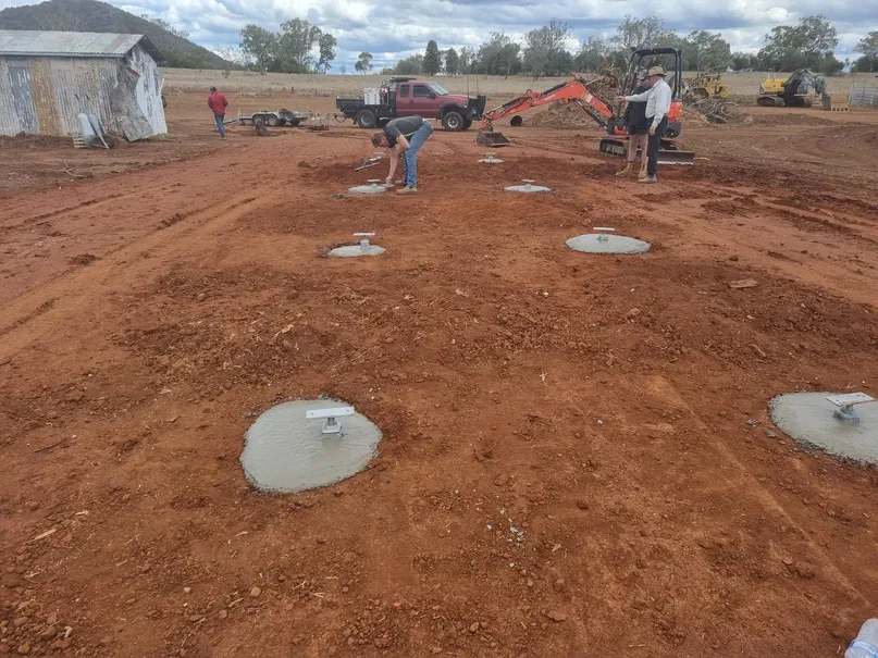 Prepared foundations and service connections before modular installation