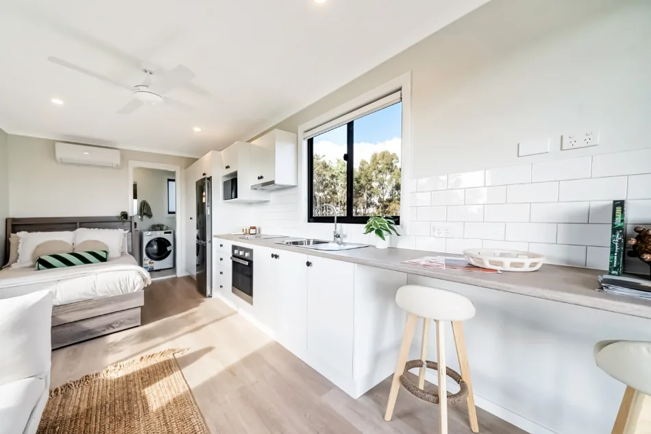 Interior of an Aruva worker accommodation studio unit with kitchen, sleeping and living areas