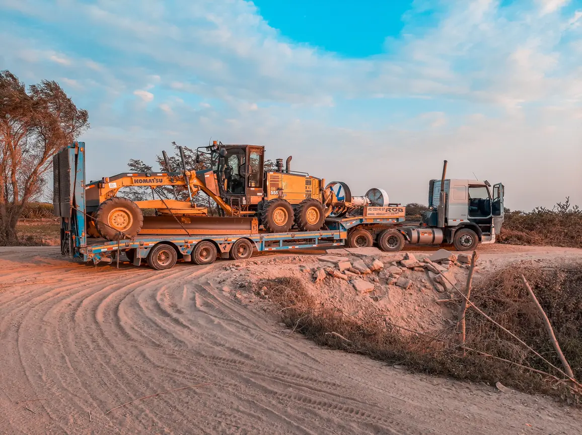 Heavy transport and machinery accessing a prepared rural building site