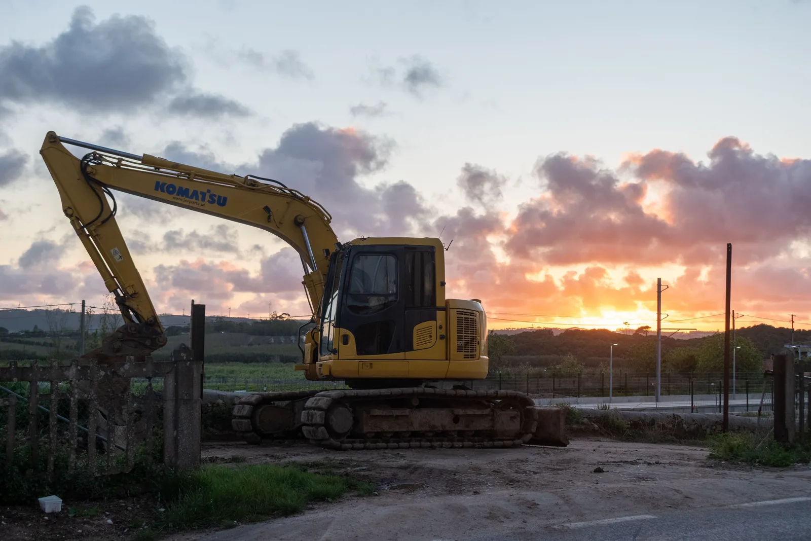 Excavator preparing a rural building site for modular housing delivery