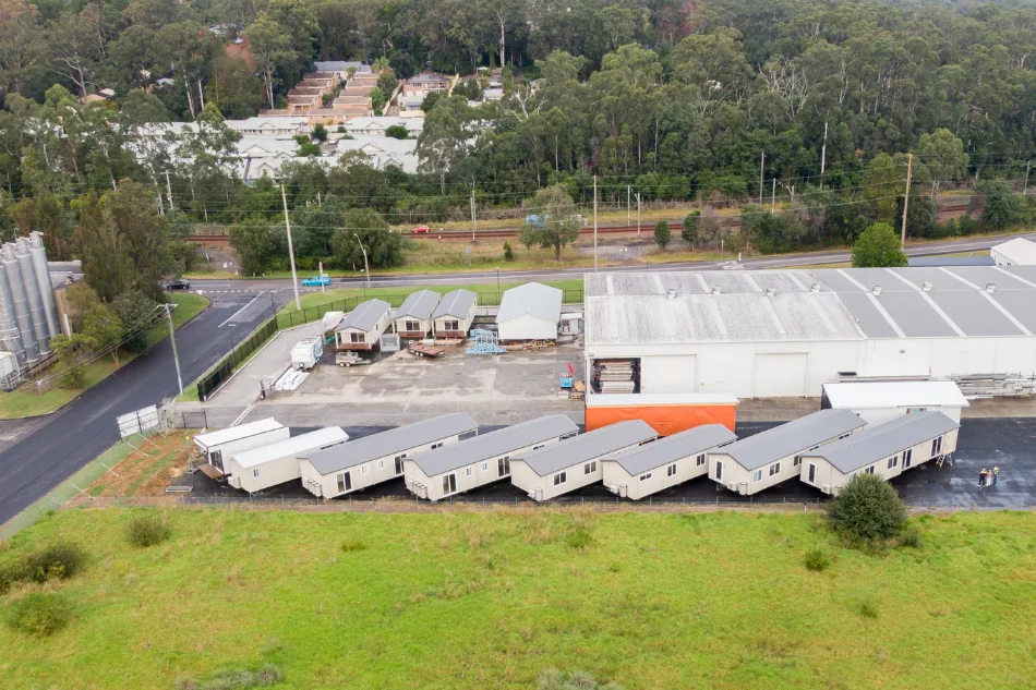 Completed stock modular housing units lined up at the Aruva manufacturing facility ready for delivery