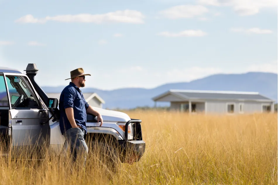 Farm manager inspecting worker housing performance on a regional property.